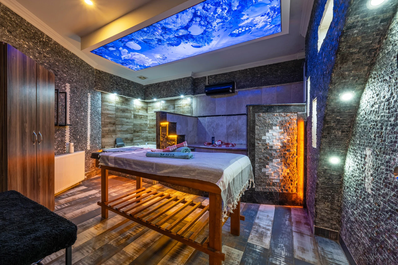 The marble wall sign of Neva Spa & Massage Salon